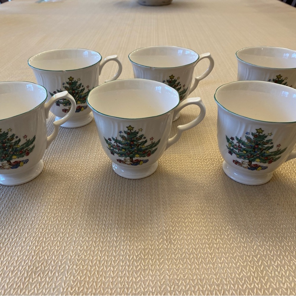 Six Nikko holiday vintage collector mugs.